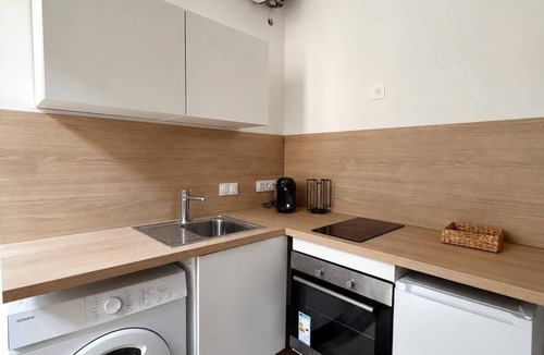 Orange Apartment | Air-conditioned studio in Bali with a balcony overlooking the ancient theater