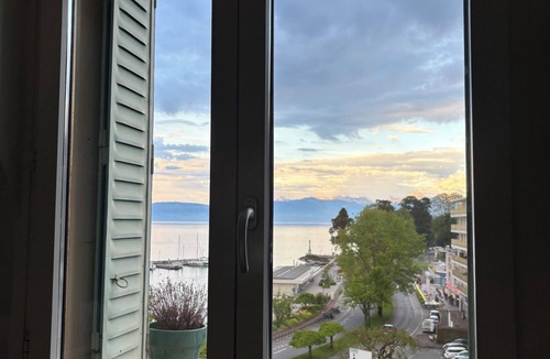 Evian-les-Bains Apartment | Charming little studio with lake and mountain views from the bed.