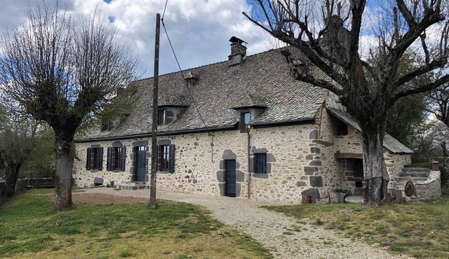 Large Auvergne-style house with a pool, pétanque court, and bread oven